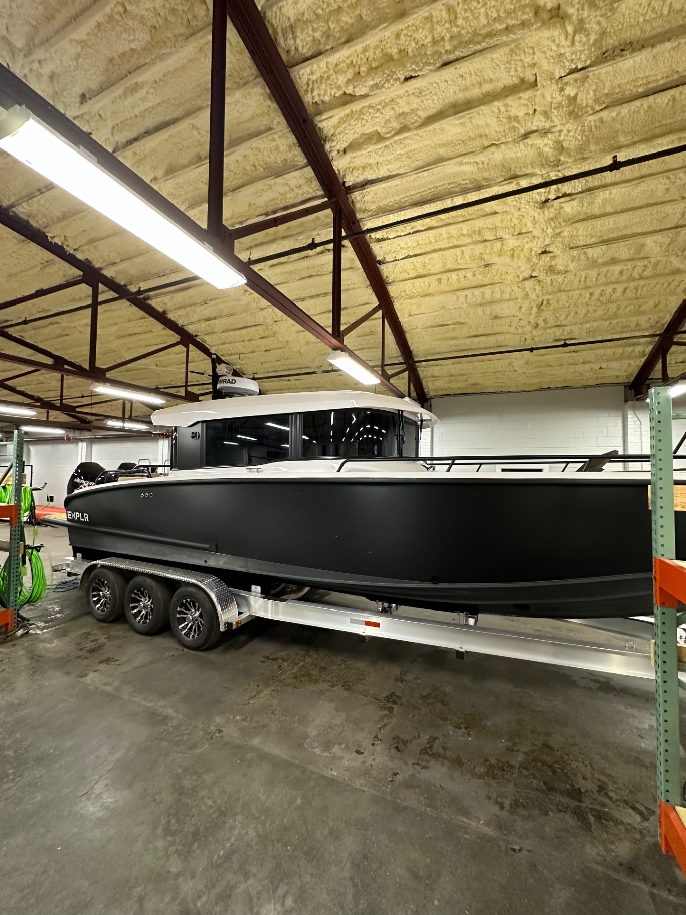 Offshore EXPLR boat with tinted cabin glass on a trailer