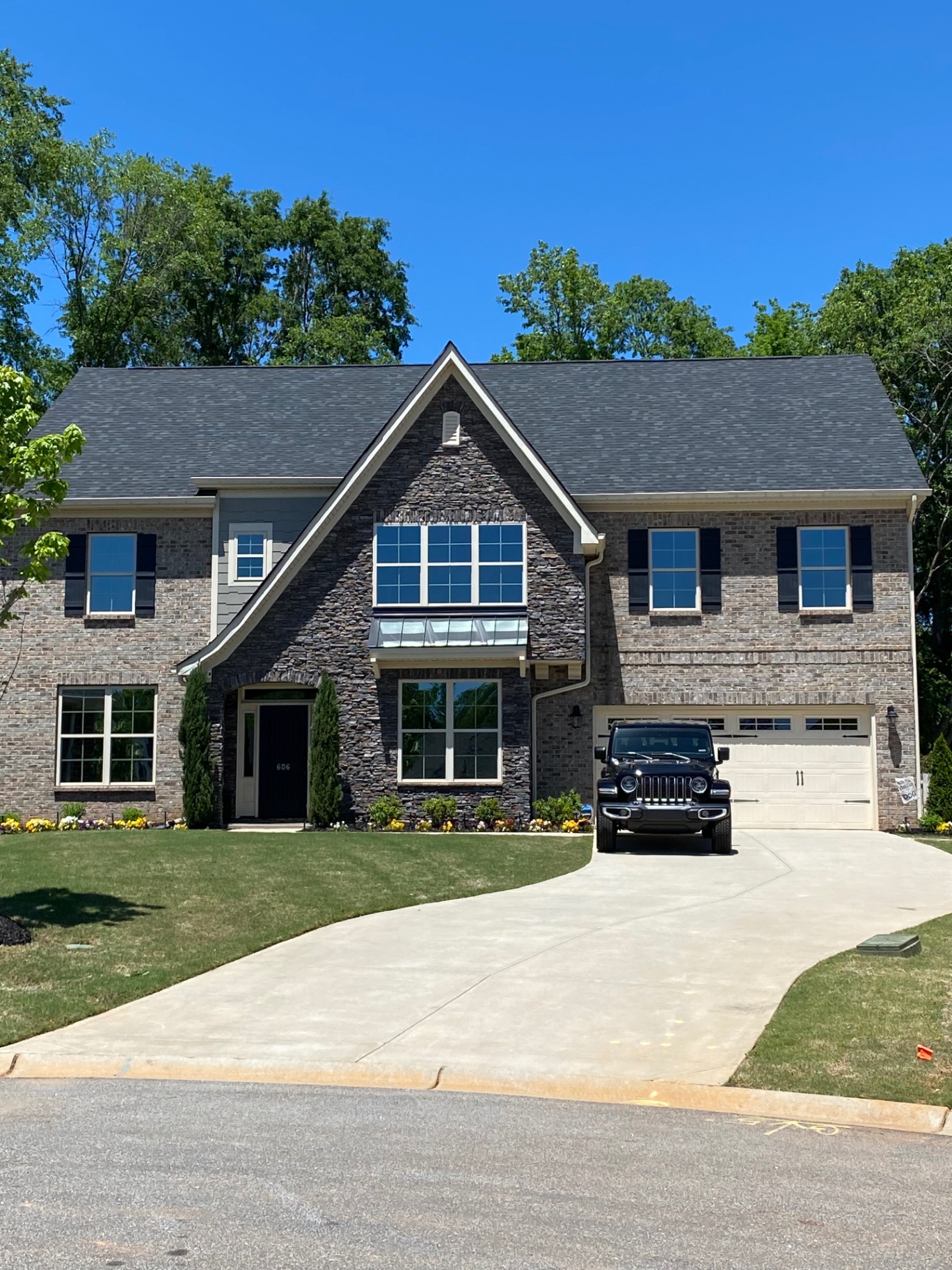 Full front view of the same home showing consistent film across the glass