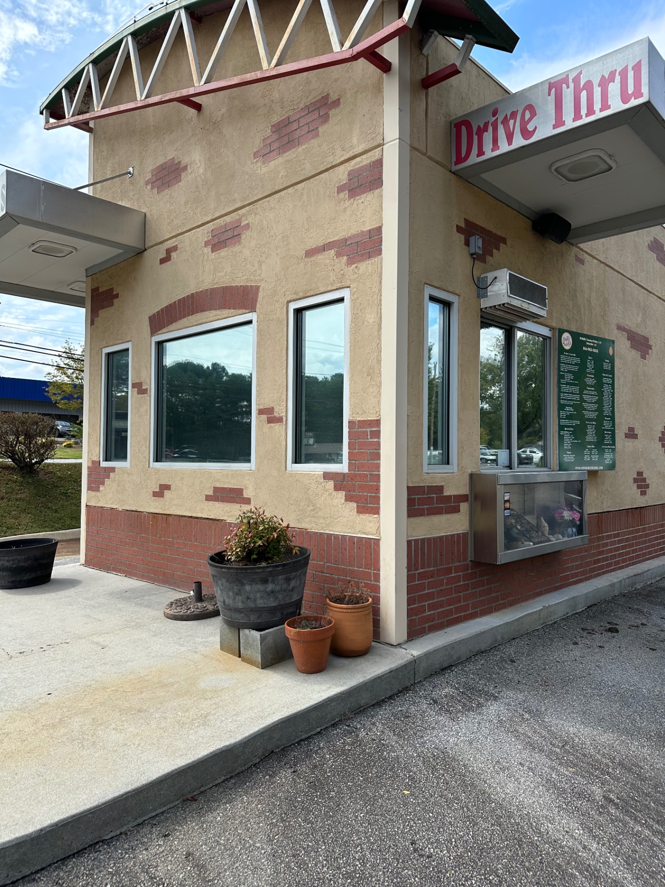 Drive-thru service building with tinted windows