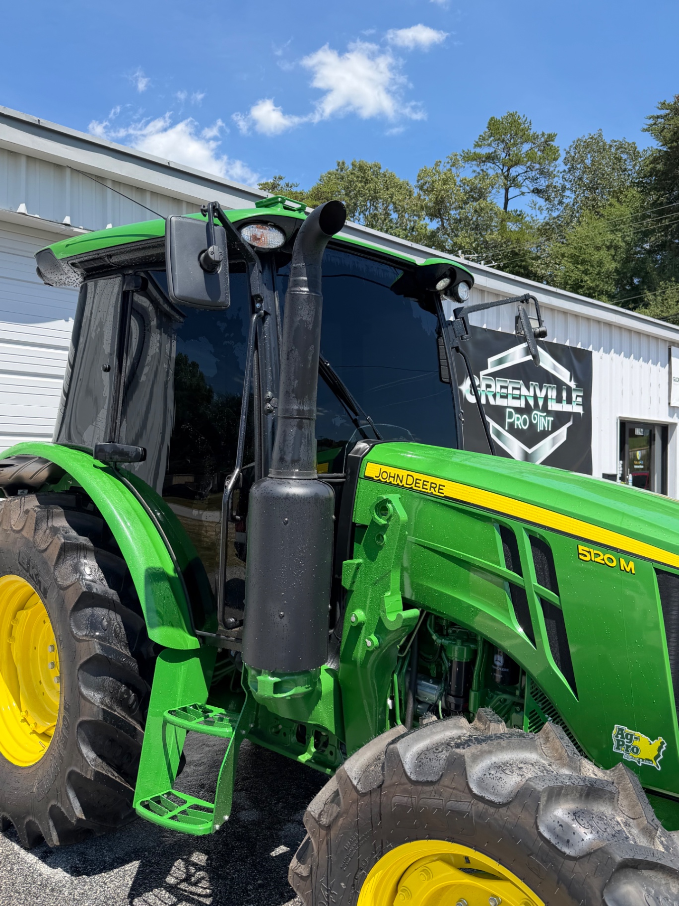 John Deere tractor with tinted cab glass at Greenville Pro Tint