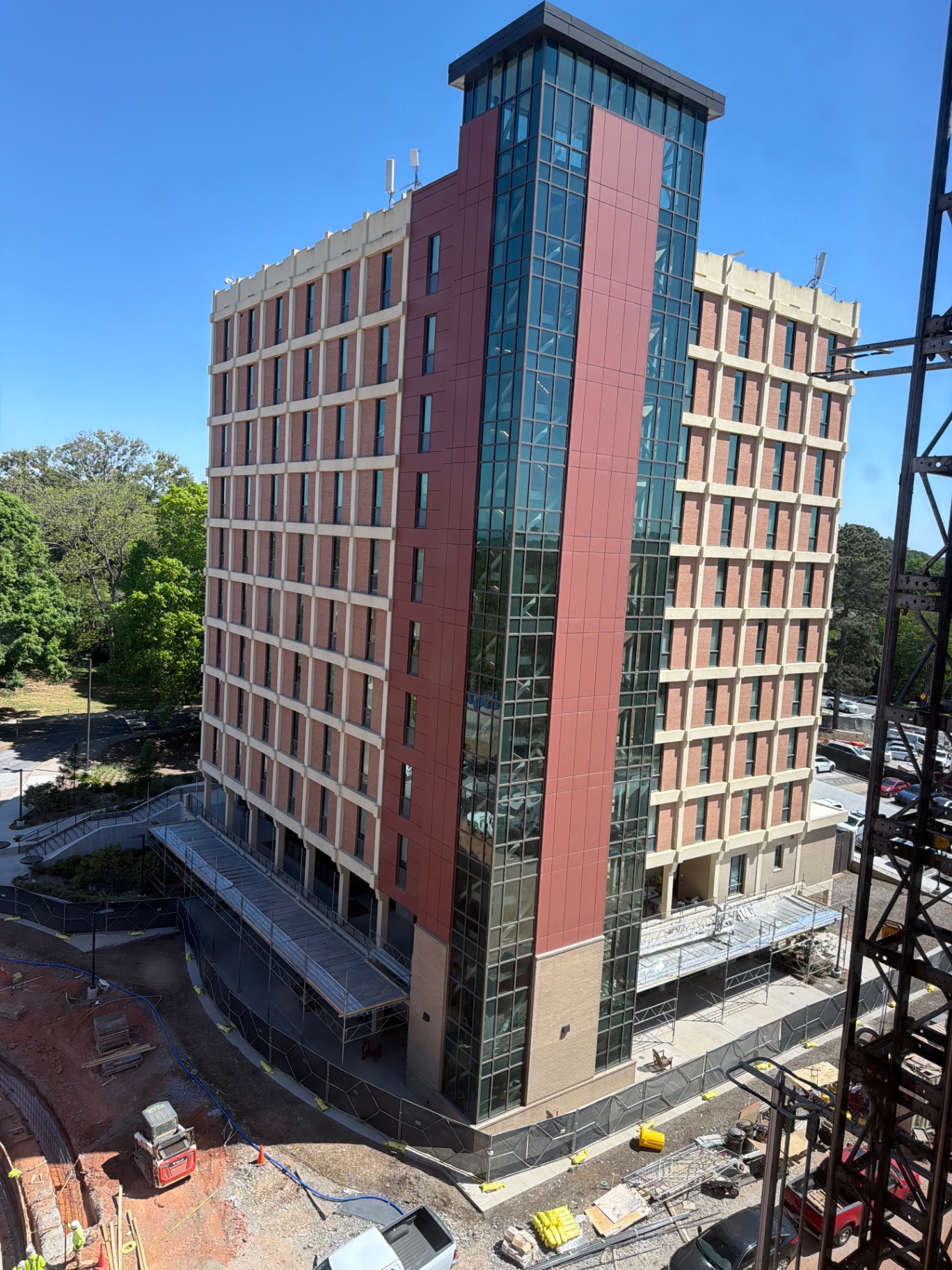 Brick and glass building under construction with architectural glazing film